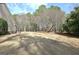 Large backyard area with mature trees providing shade and privacy at 115 Foxford Run, Tyrone, GA 30290