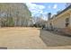 Expansive backyard of this home with a well-maintained lawn and trees along the property line at 115 Foxford Run, Tyrone, GA 30290