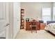 Cozy bedroom with a chair, and desk with natural light from the windows at 115 Foxford Run, Tyrone, GA 30290