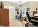 Bright bedroom with neutral walls and carpet flooring. Includes home gym equipment at 115 Foxford Run, Tyrone, GA 30290
