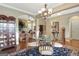 View of a dining area that includes a glass top table and seating for six people at 115 Foxford Run, Tyrone, GA 30290
