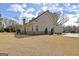 Exterior view of home with large yard, showcasing the side and back of the house at 115 Foxford Run, Tyrone, GA 30290