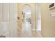 This open and airy hallway leads to an updated kitchen area with lots of natural light at 115 Foxford Run, Tyrone, GA 30290