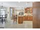 Open kitchen with granite countertops, stainless appliances, breakfast bar and tiled flooring at 115 Foxford Run, Tyrone, GA 30290