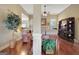 Open-concept living space with hardwood floors and view of fireplace at 115 Foxford Run, Tyrone, GA 30290