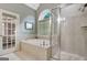 Bathroom with large tub and glass door walk in shower at 115 Foxford Run, Tyrone, GA 30290