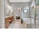 Bathroom with double sink vanity, soaking tub, and glass shower at 115 Foxford Run, Tyrone, GA 30290