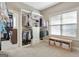 Spacious walk-in closet with built-in storage, shelving, and window at 115 Foxford Run, Tyrone, GA 30290
