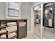 View into a secondary walk-in closet with shelves for towels and linens, wood floors, and a window at 115 Foxford Run, Tyrone, GA 30290