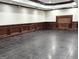 Spacious basement area with panelled walls, tiled floors and ample room for customization at 125 Turnberry Cir, Fayetteville, GA 30215
