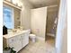 Bathroom featuring a white vanity, toilet, and walk-in shower at 125 Turnberry Cir, Fayetteville, GA 30215
