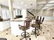Spacious kitchen with granite countertops, island seating, and stainless steel appliances at 125 Turnberry Cir, Fayetteville, GA 30215