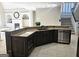 A gourmet kitchen featuring an island with granite countertops and stainless steel appliances at 125 Turnberry Cir, Fayetteville, GA 30215