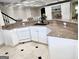 Kitchen area with granite countertops, island seating, and stainless steel appliances at 125 Turnberry Cir, Fayetteville, GA 30215