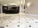A spacious living room with elegant tile flooring that connects to the kitchen at 125 Turnberry Cir, Fayetteville, GA 30215
