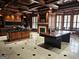 Impressive home office with custom wood finishes, a fireplace, and ample workspace at 125 Turnberry Cir, Fayetteville, GA 30215