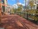 Brick patio overlooking a serene lake and landscape; black iron railing at 125 Turnberry Cir, Fayetteville, GA 30215