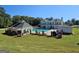 Scenic view of a large swimming pool, gazebo, and lush greenery, perfect for relaxation and community enjoyment at 125 Turnberry Cir, Fayetteville, GA 30215