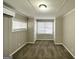 Bedroom features neutral paint, carpeted floors, and bright, natural light at 4734 Campbellton Sw Rd, Atlanta, GA 30331