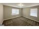 Bedroom features neutral paint, carpeted floors, and bright, natural light at 4734 Campbellton Sw Rd, Atlanta, GA 30331