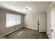 Bedroom with neutral walls, carpeted floors, and bright window light at 4734 Campbellton Sw Rd, Atlanta, GA 30331