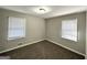 Cozy bedroom with neutral walls and carpeted floor with bright window light at 4734 Campbellton Sw Rd, Atlanta, GA 30331