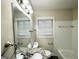 Classic bathroom with a marble vanity, double sinks, and a well-lit mirror at 2030 Mark Trl, Decatur, GA 30032