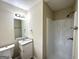 Bathroom featuring a single sink vanity with granite counters and a shower and tub at 2030 Mark Trl, Decatur, GA 30032