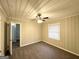 Neutral bedroom featuring a ceiling fan, carpeting, and a bright window at 2030 Mark Trl, Decatur, GA 30032