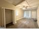 Bedroom featuring neutral walls, a ceiling fan, and a closet at 2030 Mark Trl, Decatur, GA 30032