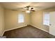 Neutral bedroom featuring a ceiling fan, carpeting, and a bright window at 2030 Mark Trl, Decatur, GA 30032