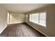 Bright and airy living room features modern flooring, natural light and neutral decor at 2030 Mark Trl, Decatur, GA 30032