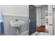 Compact bathroom featuring a vintage-style sink and fixtures, plus patterned flooring at 110 Bevis Cir, Bowdon, GA 30108