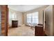 Bedroom showcasing hardwood floors, and a sun-drenched window for a restful ambiance at 110 Bevis Cir, Bowdon, GA 30108