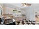The kitchen has black and white checkered floors, vintage cabinets, and a stainless range at 110 Bevis Cir, Bowdon, GA 30108