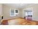 Inviting living room featuring weathered floors, light-colored walls, and windows for natural light at 110 Bevis Cir, Bowdon, GA 30108