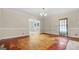 Spacious living room with weathered floors, paneled walls, and natural light throughout at 110 Bevis Cir, Bowdon, GA 30108