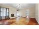 Bright living room boasting a decorative fireplace, weathered floors, and ample space at 110 Bevis Cir, Bowdon, GA 30108