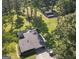 Aerial view of the house and barn with lots of trees on a sprawling green lawn at 225 Banks Rd, Fayetteville, GA 30214