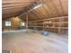 Partially finished attic with exposed beams, natural light, and plenty of storage space at 225 Banks Rd, Fayetteville, GA 30214