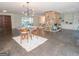 Large living room with tile floors, fireplace, built-in shelving, and modern lighting at 225 Banks Rd, Fayetteville, GA 30214