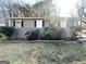 Modest single-story home with a small front yard and a combination of brick and siding exterior at 411 Argus Nw Cir, Atlanta, GA 30331