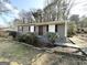 Modest single-story home with a small front yard and a combination of brick and siding exterior at 411 Argus Nw Cir, Atlanta, GA 30331