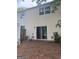 View of the backyard with sliding glass doors and air conditioning unit at 923 Regal Path Ln, Decatur, GA 30030