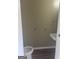 Cozy powder room features a modern sink and toilet, with wood-look laminate flooring at 923 Regal Path Ln, Decatur, GA 30030