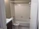 Bathroom featuring tub and shower with tile surround and classic style vanity at 923 Regal Path Ln, Decatur, GA 30030