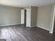 Spacious bedroom with new flooring and closet with sliding doors at 923 Regal Path Ln, Decatur, GA 30030