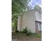 Exterior of home featuring vinyl siding, brick accents, and shuttered windows at 923 Regal Path Ln, Decatur, GA 30030