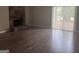Bright living room with a stone fireplace and sliding glass doors leading to the outdoors at 923 Regal Path Ln, Decatur, GA 30030