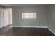 Spacious living room with wood-look laminate flooring and a pass-through to the kitchen at 923 Regal Path Ln, Decatur, GA 30030